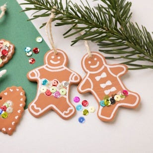 Collage image - Gingerbread men made of Silk Clay