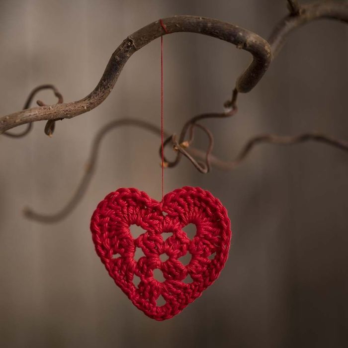 A small heart crocheted from cotton yarn