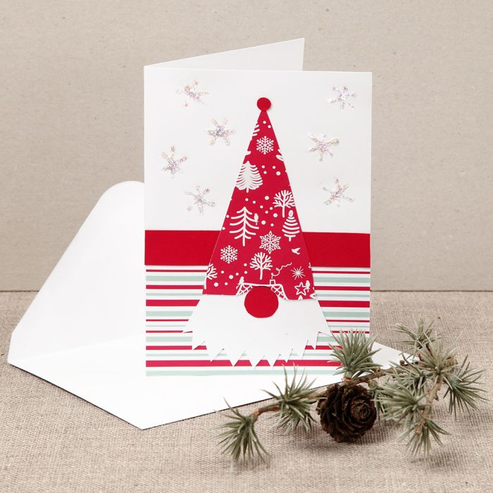A Christmas card with a nosy elf made from design paper