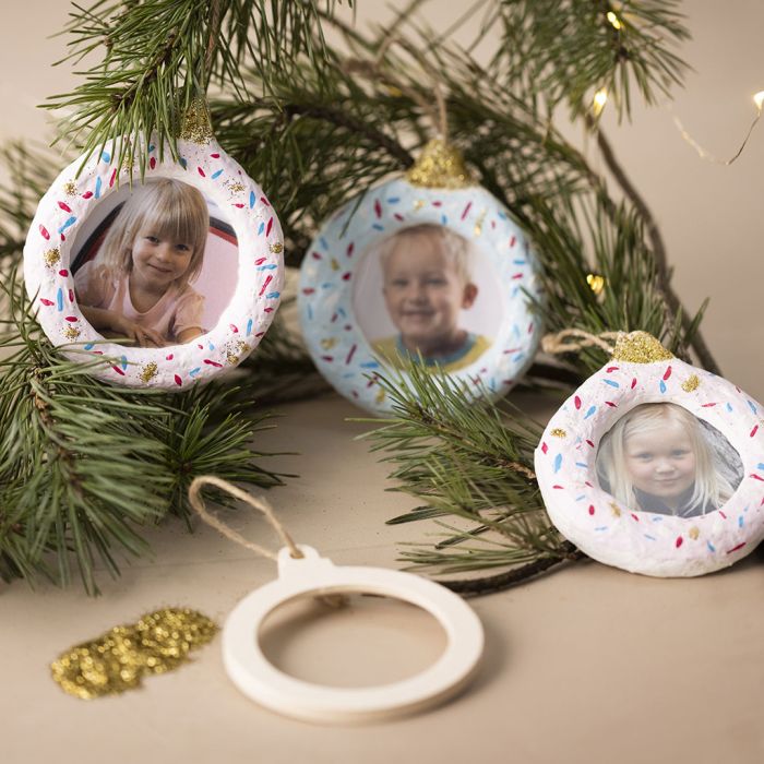 hanging Christmas decorations with photos