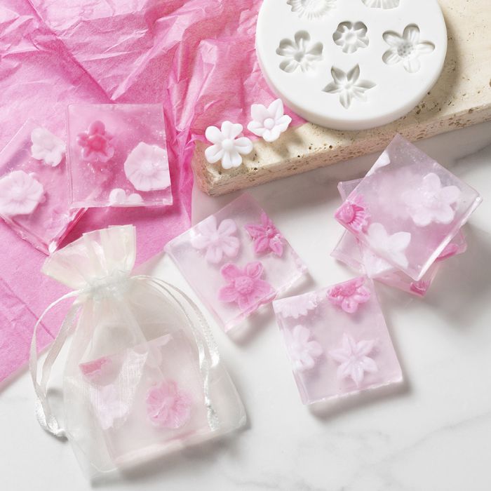 Transparent soap with moulded flowers