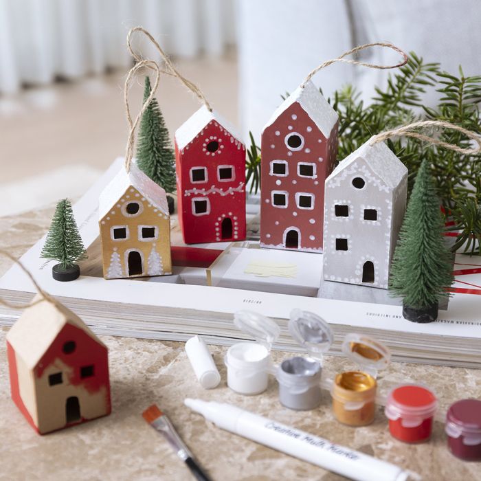 Painted Christmas houses with snow on top