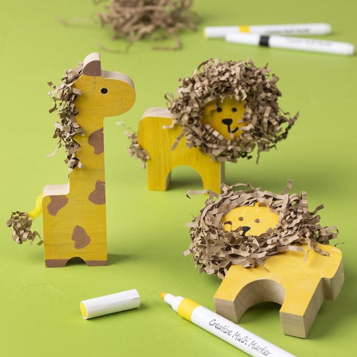 Wild wooden animals decorated with markers and crinkle paper