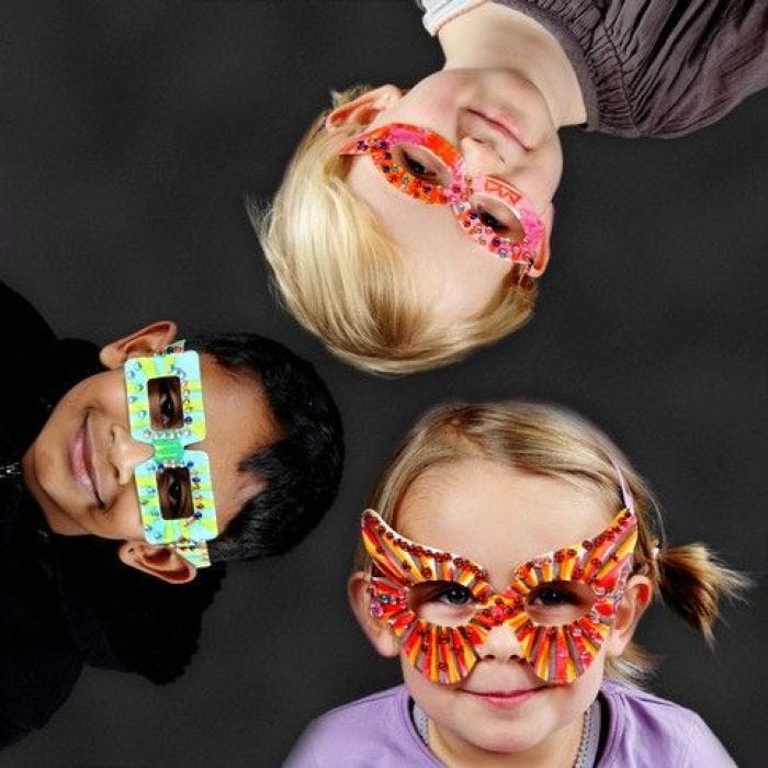 A Card Mask shaped like a Pair of Glasses