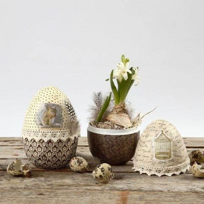 A two-part decoupaged Papier-Mâché Egg with Lace & Down Waistband