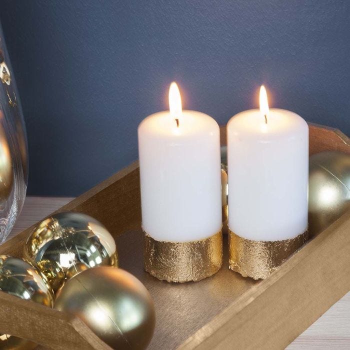 A Pillar Candle with a Gold Imitation Metal Leaf Border