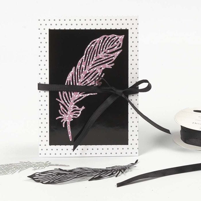 A patterned Card decorated with a die-cut Paper Feather