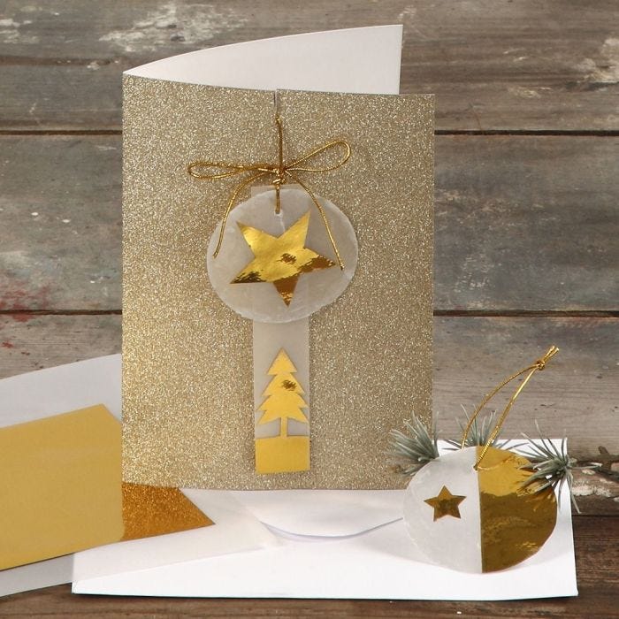 A Greeting Card with Glitter decorated with Gold and Vellum Paper