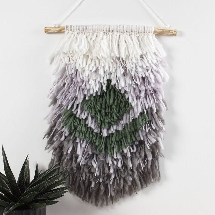 A Latch hooked Wall Hanging with woollen Yarn