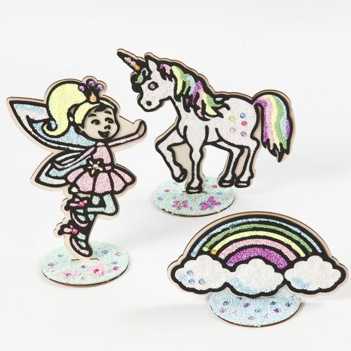 A wooden Fairy, a wooden Unicorn and a wooden Rainbow filled with Foam Clay