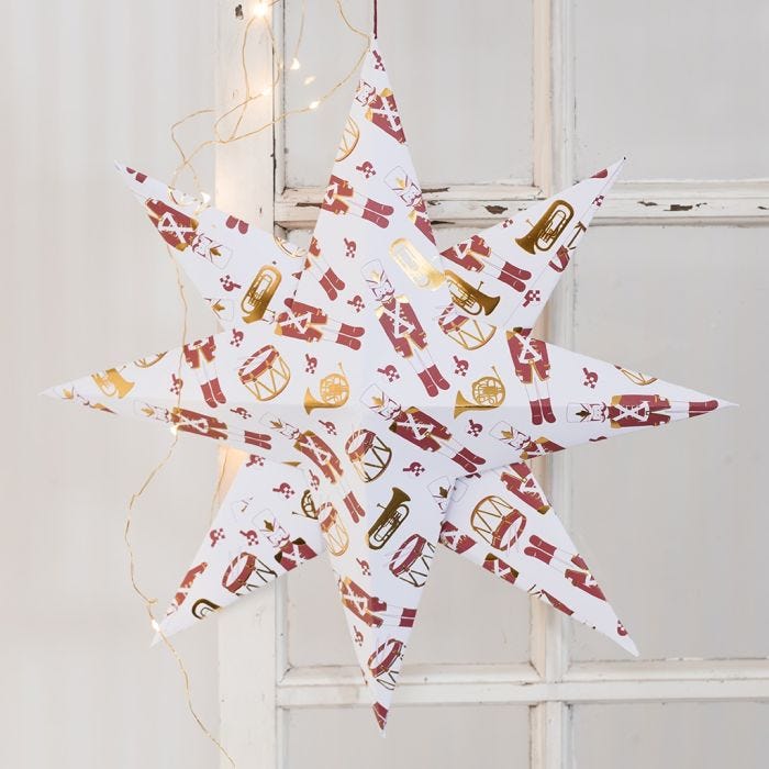 A large Star folded from Design Paper with a Nutcracker Motif