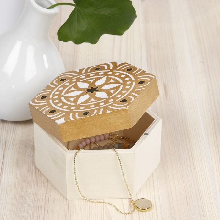 A wooden Storage Box decorated with a stencilled Ethnic Design