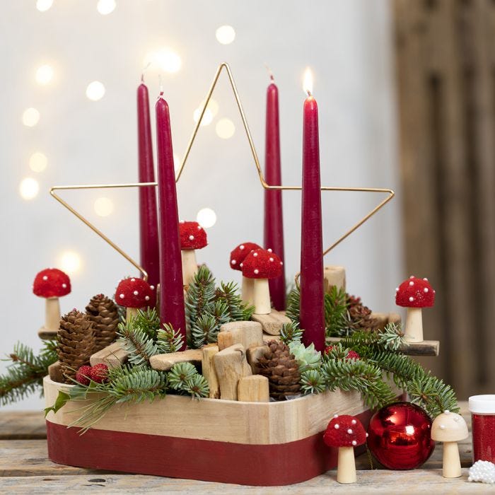 An Advent Wreath with a Metal Star, Toadstools, Spruce, Pine Cones and mixed Wood Pieces