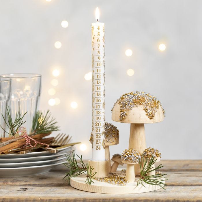 A Candlestick on a wooden Base with Toadstools decorated with mini Glass Beads