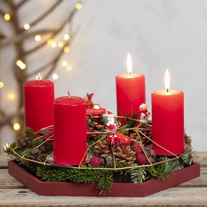 An Advent Wreath from a Metal Hanging Decoration decorated with Spruce, Pine Cones and Miniature Figures