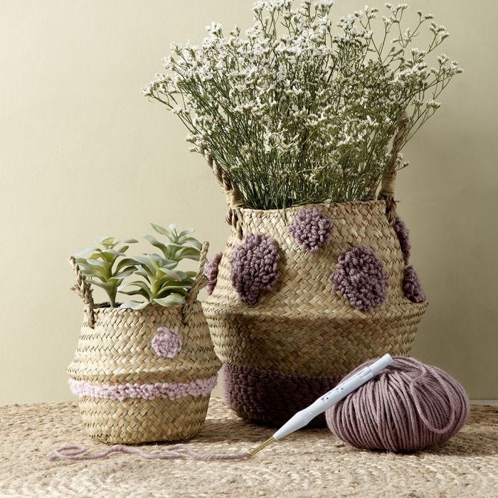 A basket with punch needle embroidered designs