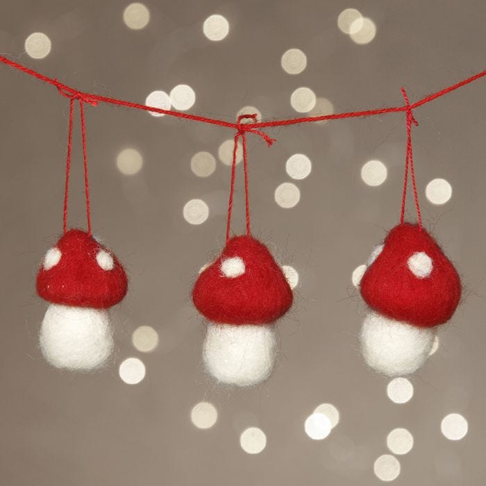 A garland with needle-felted toadstools