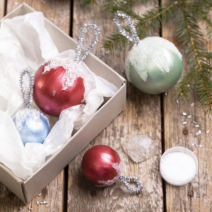 Christmas baubles decorated with Art Metal paint and artificial snow