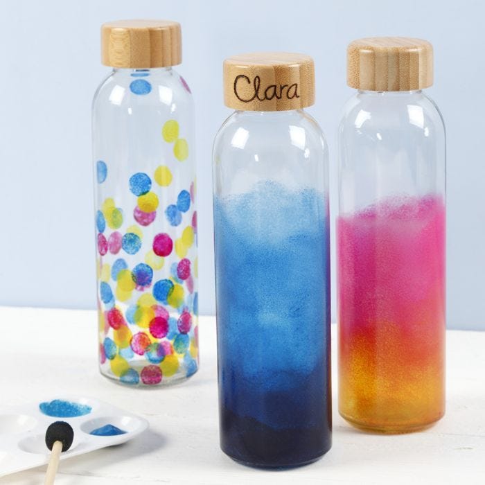 A water bottle decorated with glass paint