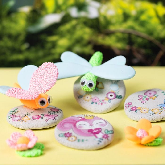 Modelled stones with stickers and insects