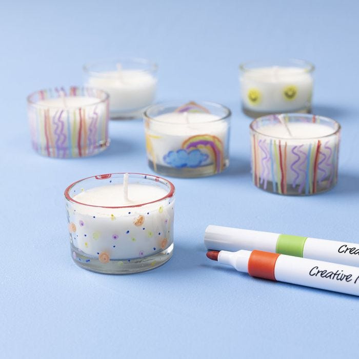 Candle cast in a tealight holder and decorated with markers