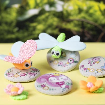 Modelled stones with stickers and insects