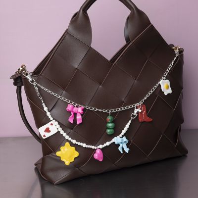 Charm chain with pendants made of fine clay