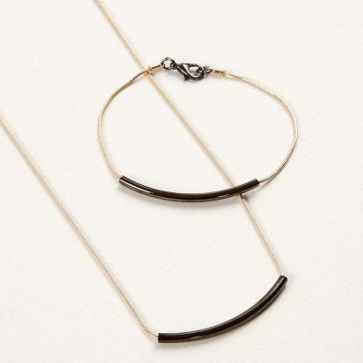 Jewellery made from articulated Chains with curved Tube Pendants