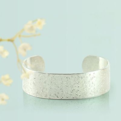 A wide textured Metal Bracelet