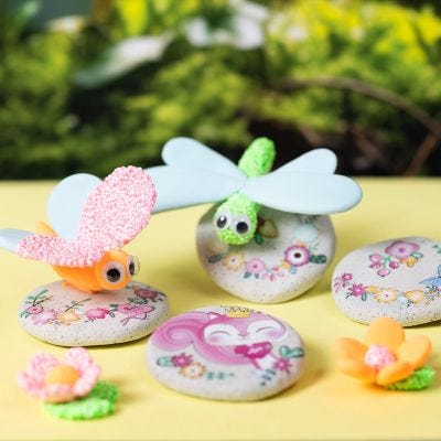 Modelled stones with stickers and insects