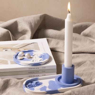 Cast a candle holder and tray with an embossed design