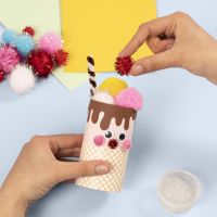 An ice cream cone from a cardboard tube decorated with basic craft materials